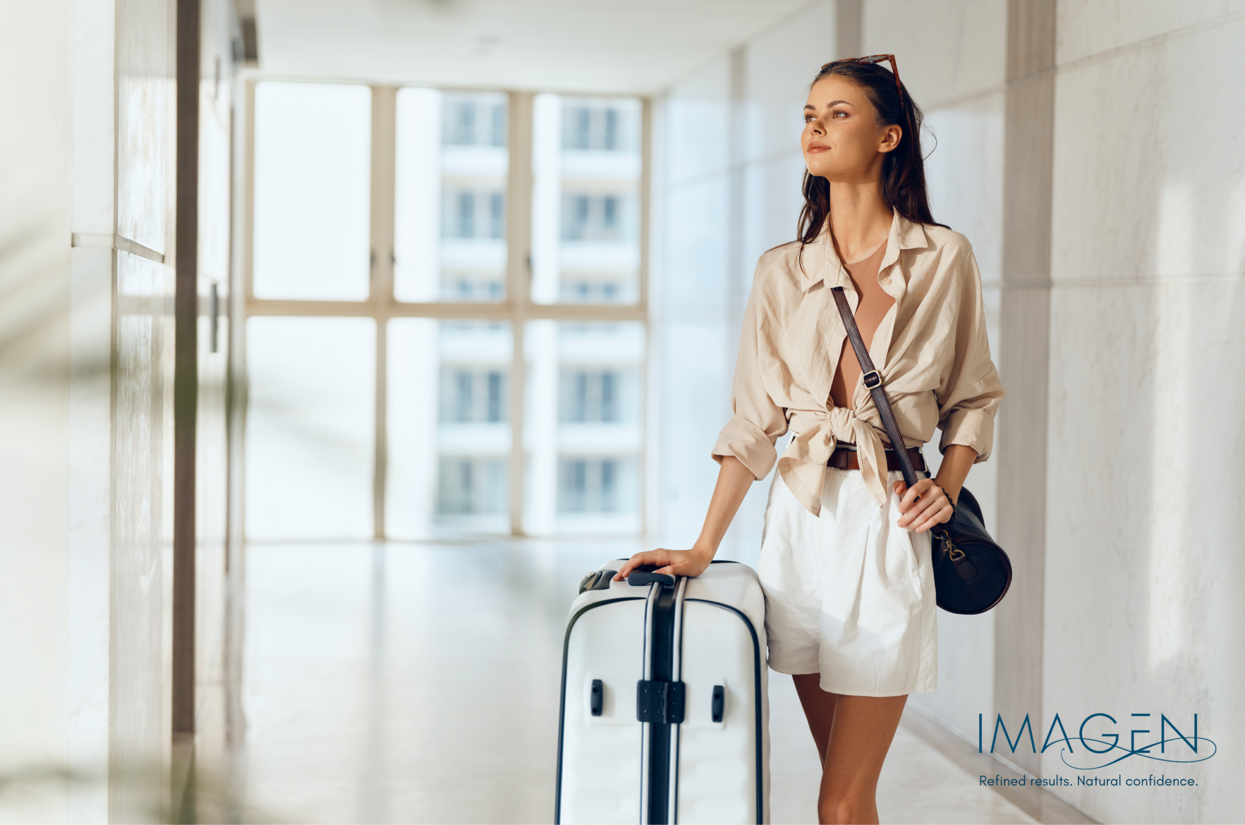 Woman walking through airport with carry-on suitcase representing independence, fitness, and VO2 max longevity in Omaha